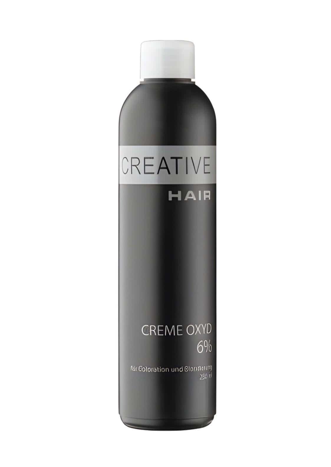 Ein eleganter schwarzer flasche creative hair creme entwickler h2o2 creme oxyd 6 % mit weißem verschluss und silbernem etikett