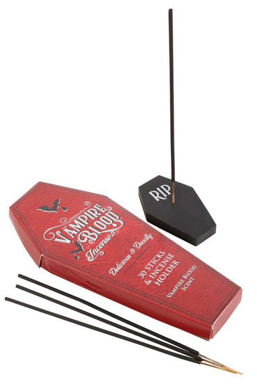 Roter sargförmiger behälter mit vampire blood räucherstäbchen in schwarz und passendem schwarzem sechseckigem coffin holder