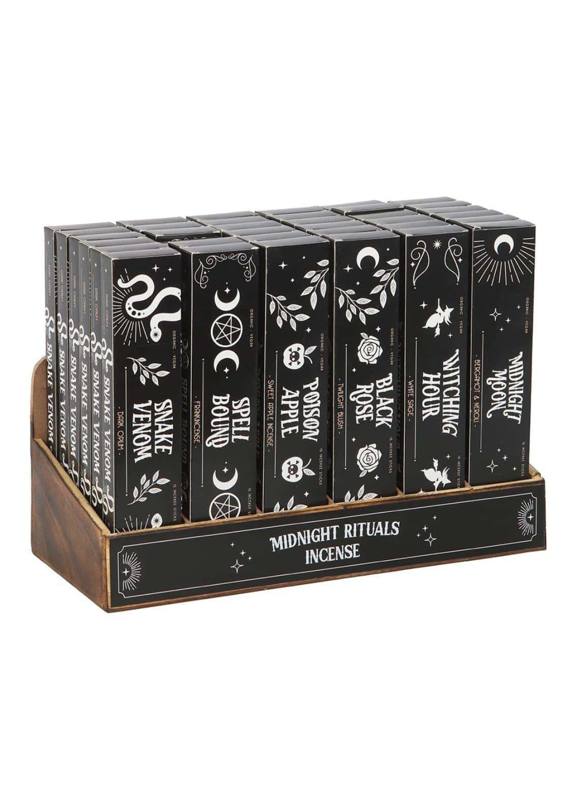 Black rechteckige räucherstäbchen boxen mit weißen okkultmotiven im holztablett gothic horror dark fashion