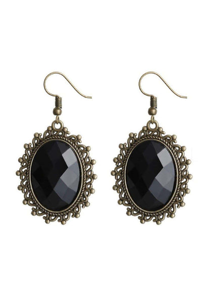Antike bronzene ovale spike-ohrringe mit schwarzen onyx steinen im gotischen stil und auffälligem design