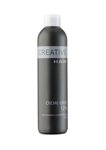 Dunkelgraue zylindrische flasche mit weißem deckel und silbernem etikett creative hair creme creme oxyd 12 % für haartönung und blondierung