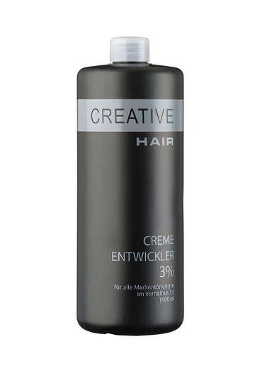Eine schlanke dunkelgraue flasche creative haar entwickler h2o2 creme oxyd 3% mit weißem deckel und silbernem etikett