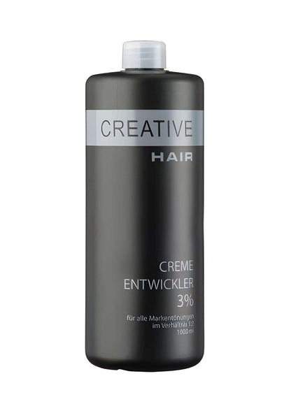 Eine schlanke dunkelgraue flasche creative haar entwickler h2o2 creme oxyd 3% mit weißem deckel und silbernem etikett