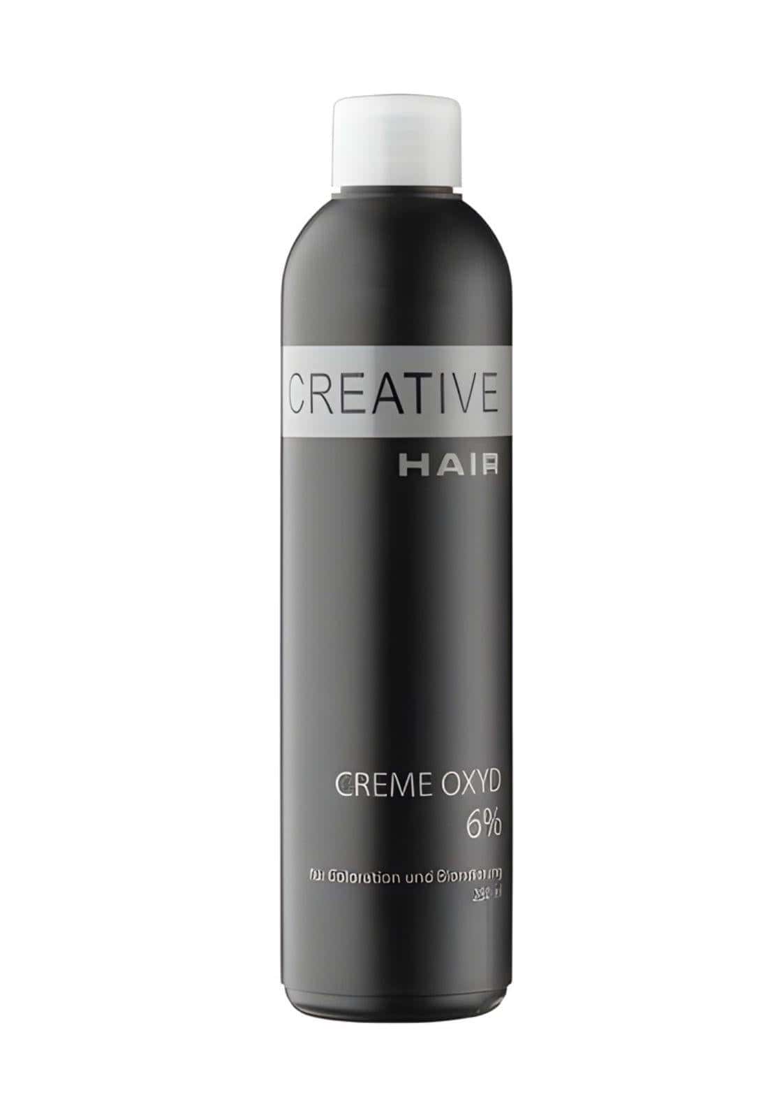 Eine schlanke schwarze flasche kreative haarcreme entwickler h2o2 creme oxyd 3 % mit weißem deckel und silbernem etikett