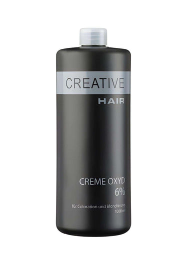 Ein eleganter dunkelgrauer kunststoffflasche mit silbernem label und weißem deckel kreative haare h2o2 creme oxyd haar entwickler 6% für blondierung