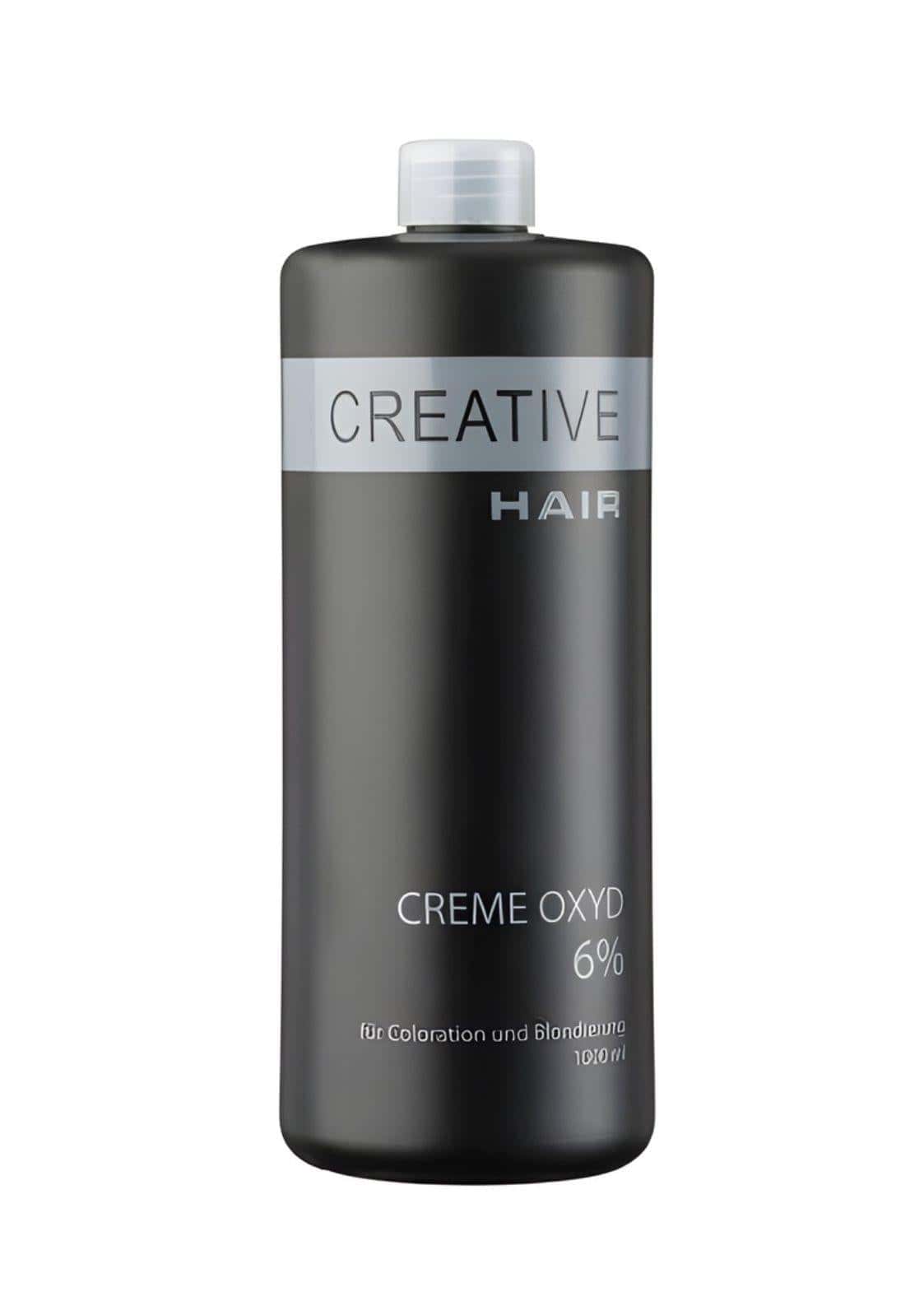 Ein eleganter dunkelgrauer kunststoffflasche mit silbernem label und weißem deckel kreative haare h2o2 creme oxyd haar entwickler 6% für blondierung