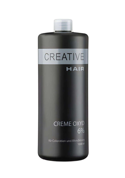 Ein eleganter dunkelgrauer kunststoffflasche mit silbernem label und weißem deckel kreative haare h2o2 creme oxyd haar entwickler 6% für blondierung