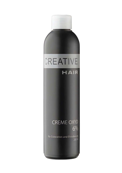 Ein eleganter schwarzer flasche creative hair creme entwickler h2o2 creme oxyd 6 % mit weißem verschluss und silbernem etikett