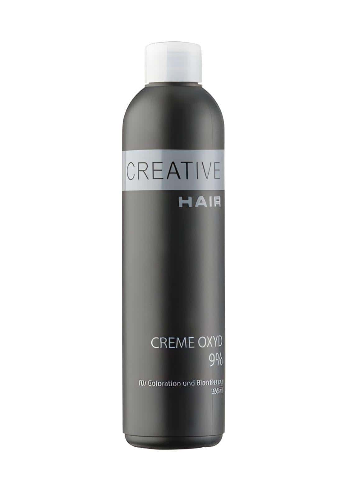 Ein schlanker dunkelgrauer flasche creative hair creme entwickler h2o2 creme oxyd 9 % mit weißem verschluss