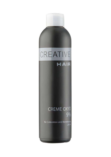 Ein schlanker dunkelgrauer flasche creative hair creme entwickler h2o2 creme oxyd 9 % mit weißem verschluss