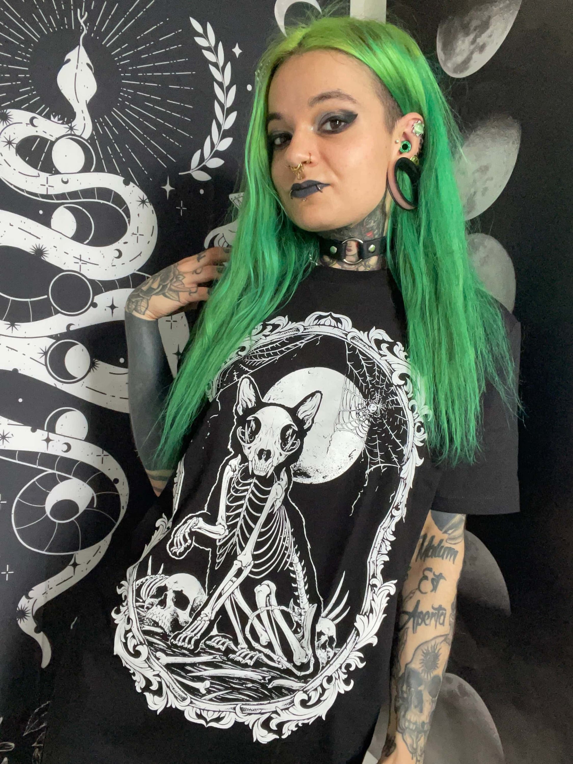 Black t-shirt with gothic white skeleton cat graphic under a full moon framed by skulls for horror fans
