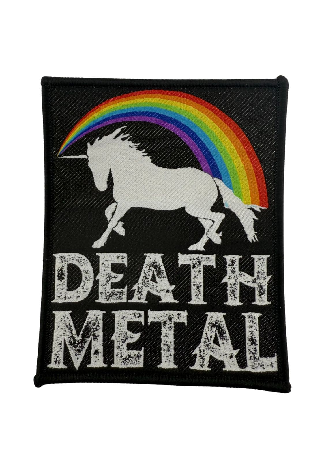 Schwarzer Aufnäher mit einem weißen Einhorn und einem Regenbogen.