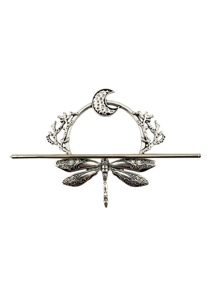 Silberne Libellenschließe mit Mond- und Blumenakzenten.
