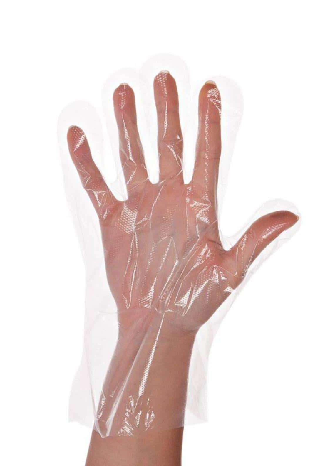 Transparente einweghandschuhe aus plastik auf hand getragen ideal für intensive haarfarben und gothic hair