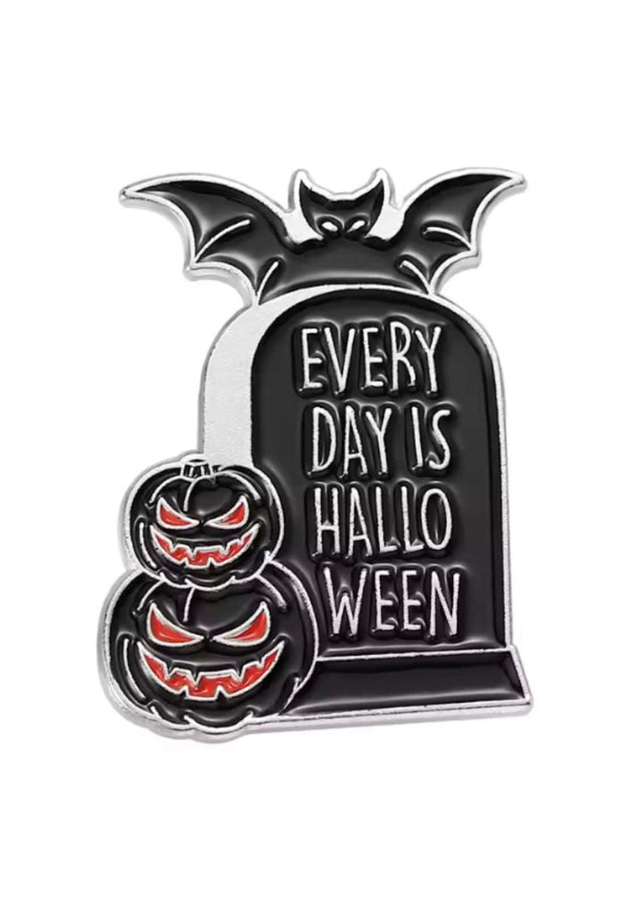 Black and silver gothic enamel pin with pumpkins bats and tombstone design from every day is halloween collection