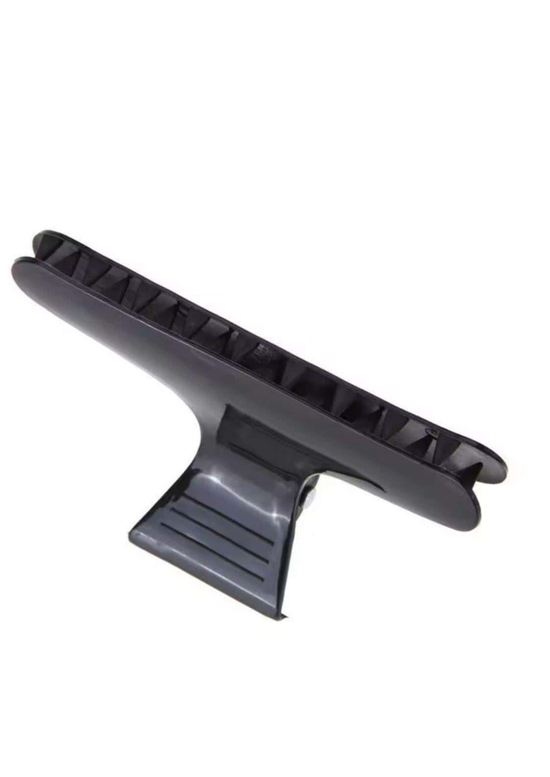 Große schwarze haarspange aus plastik mit glatten kanten und texturierten ridges für kreative looks und zuverlässiges friseurzubehör
