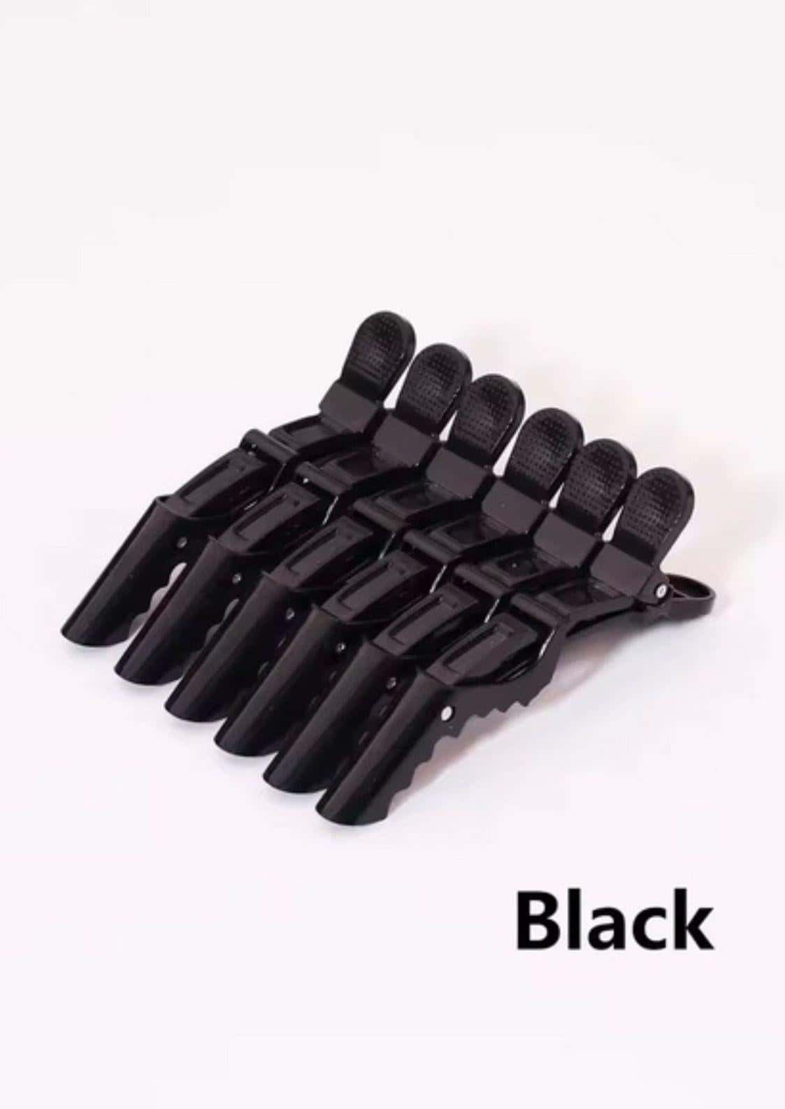 Set aus sechs schwarzen plastik haarspangen mit texturierter griffoberfläche für präzises abteilen im professionelles friseur zubehör