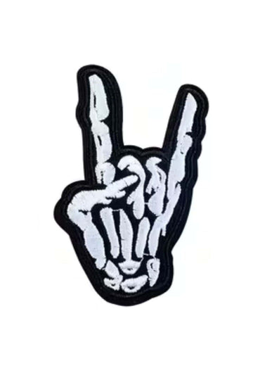 Embroidered metal hand patch in gothic skeleton design showing rock on gesture for horror style clothing