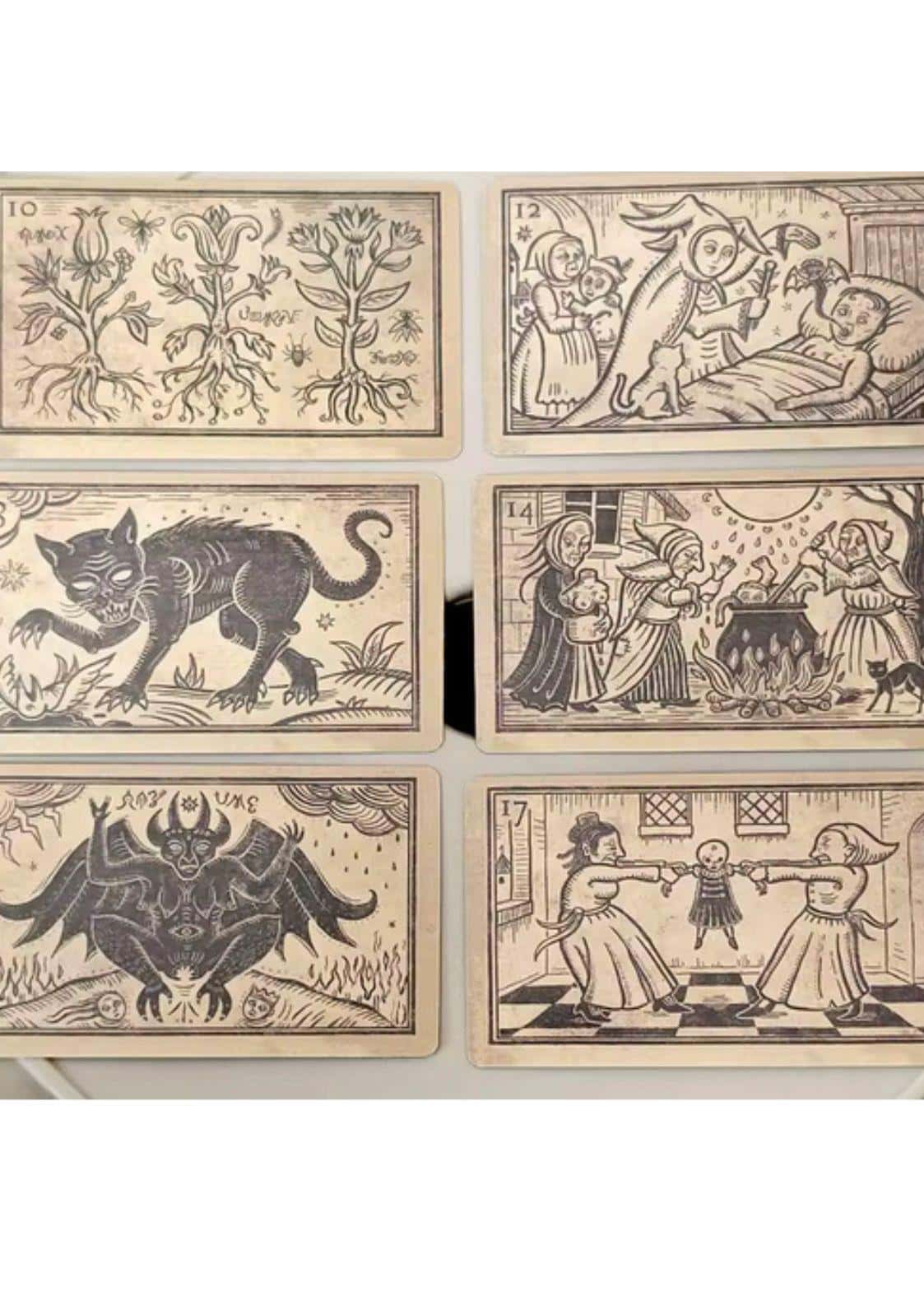 Vintage-stil illustrierte mildred payne oracle of black enchantment tarotkarten mit schwarzen tinten designs auf gealtertem karton im gothic horror look