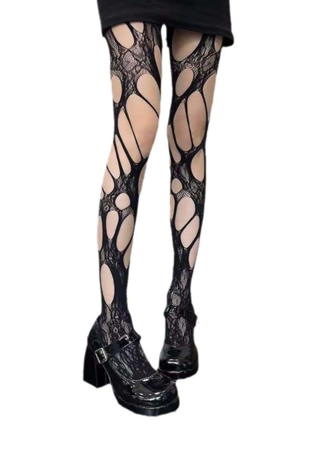 Netztstrumpfhose disturbed in schwarz mit boldem geometrischem cutout muster und düsteren akzenten