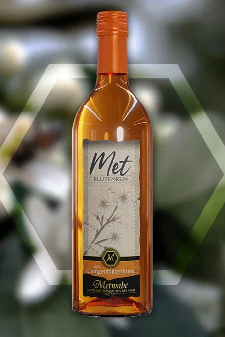 Flasche mit orangefarbenem Met.