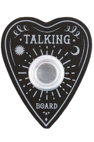 Schwarzes herzförmiges ouija board mit weißer verzierung und silbernem metallzentrum als kerzenständer