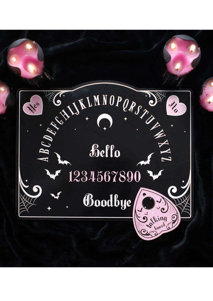 Pink and black ouija board with white lettering pink accents crescent moon bats hello and goodbye with matching pink talking bowl