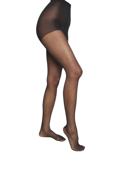 Schwarze sheer strumpfhose mit subtilem punkte-muster polka dot punkte im gotischen stil mit geometrischem cutout