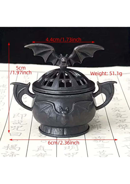 Schwarzer cast iron räucherkegelhalter fledermaus mit flügeldeckel und dekorativen griffen zur räucherwerknutzung