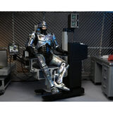 ROBOCOP DAMAGED BATTLE WITH CHAIR ULTIMATE 18CM - FIGURE