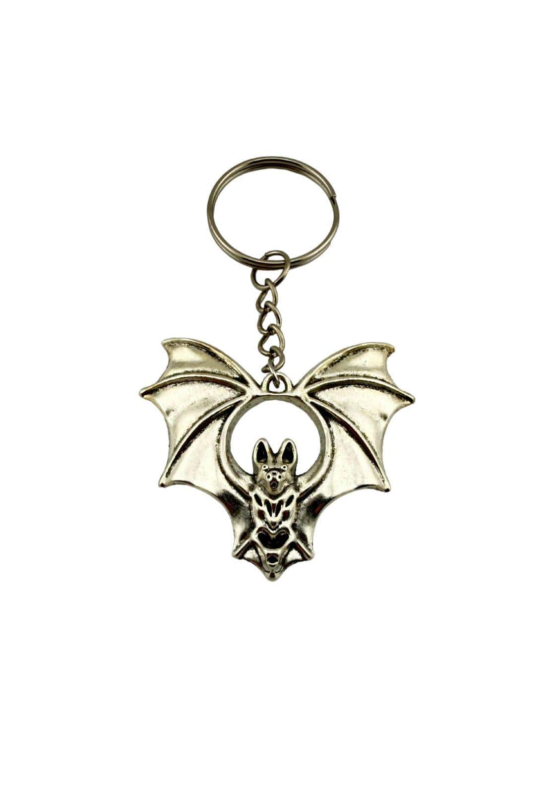 Silberner schlüsselanhänger the bat in fledermausform mit detaillierten flügeln und mittigem rundem ausschnitt für alltag zeigen