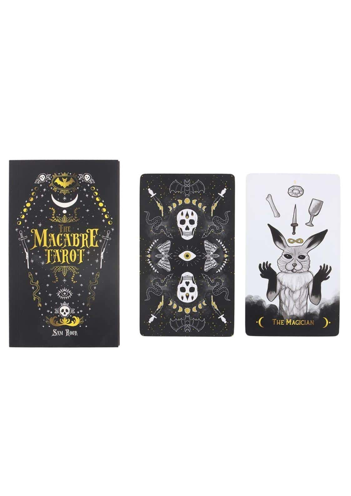 The macabre tarot deck features black and gold gothic design with skull and anthropomorphic rabbit cards in tarotkarten set