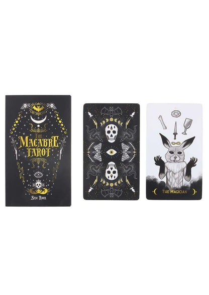 The macabre tarot deck features black and gold gothic design with skull and anthropomorphic rabbit cards in tarotkarten set