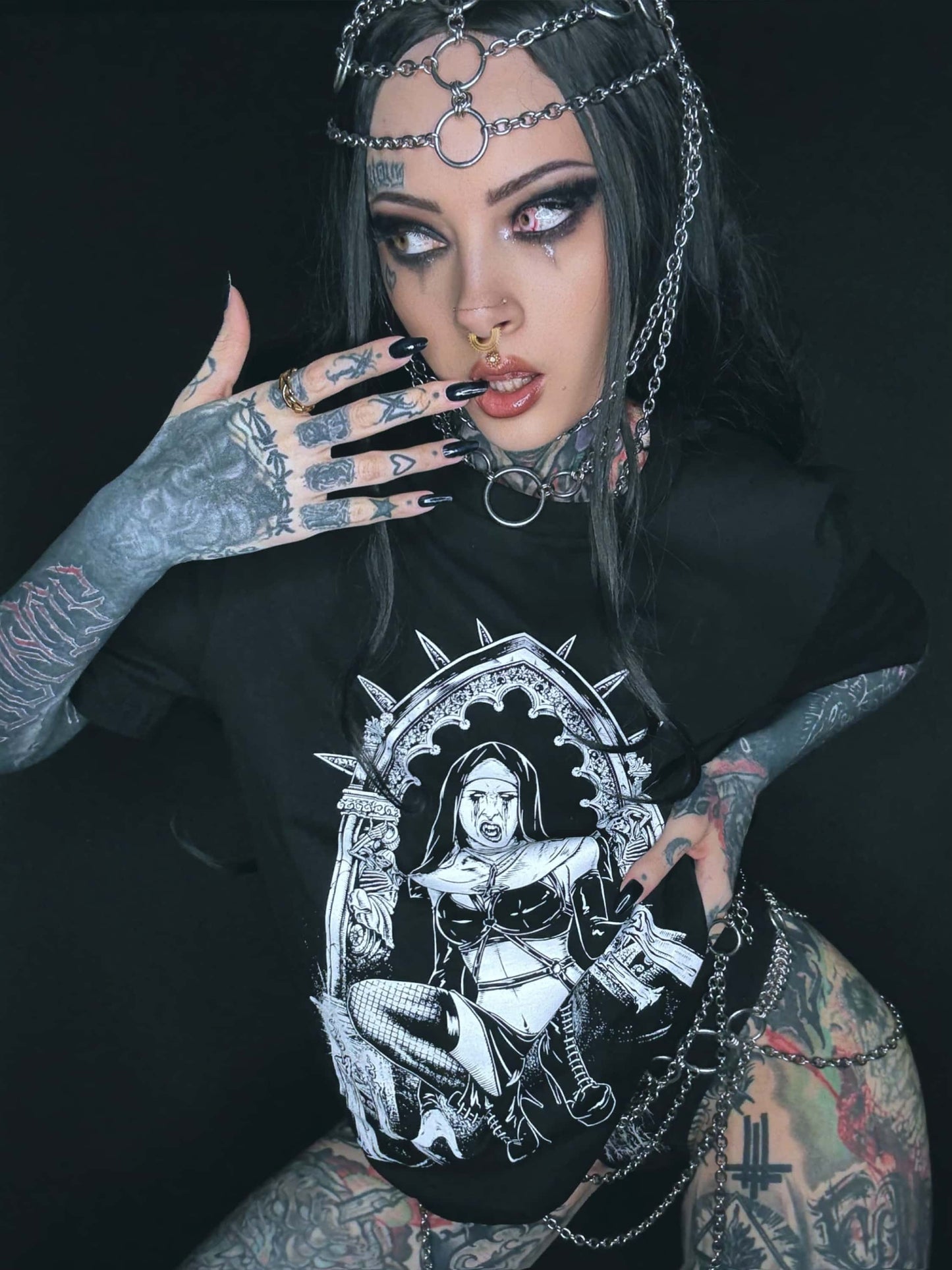 Black gothic graphic tee featuring a white horror vampire nun design with spiky crown and chains