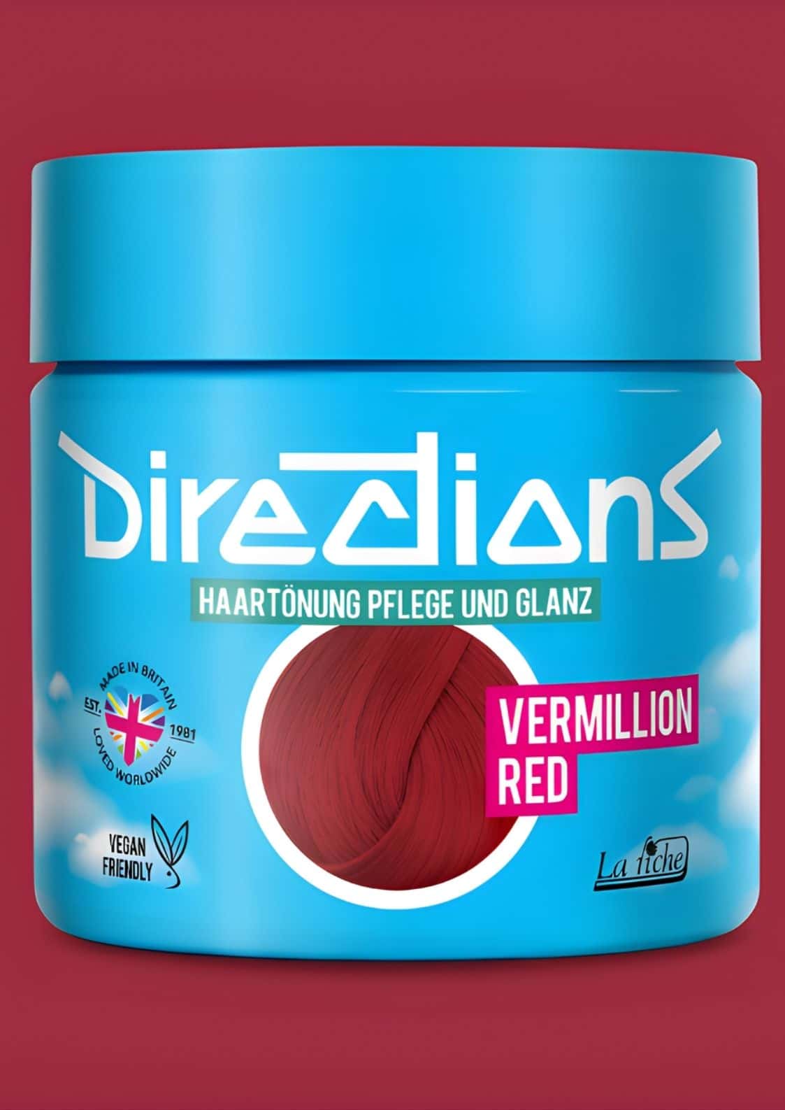 Ein leuchtend blauer zylinderförmiger directions haartönung jar in vermillion rot mit intensiver tiefroter haarfarbe und weißer markierung