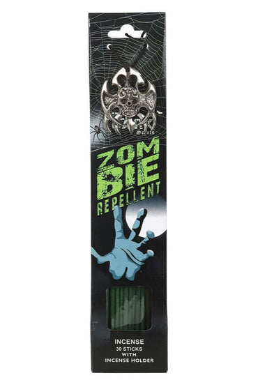 Zombie repellent incense sticks mit silbernem schädelmotiv in schwarzer und grüner verpackung mit halter und drachenblut duft