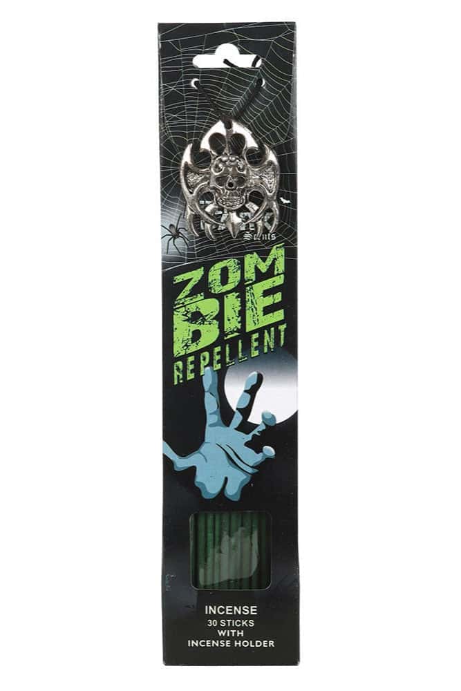 Zombie repellent incense sticks mit silbernem schädelmotiv in schwarzer und grüner verpackung mit halter und drachenblut duft
